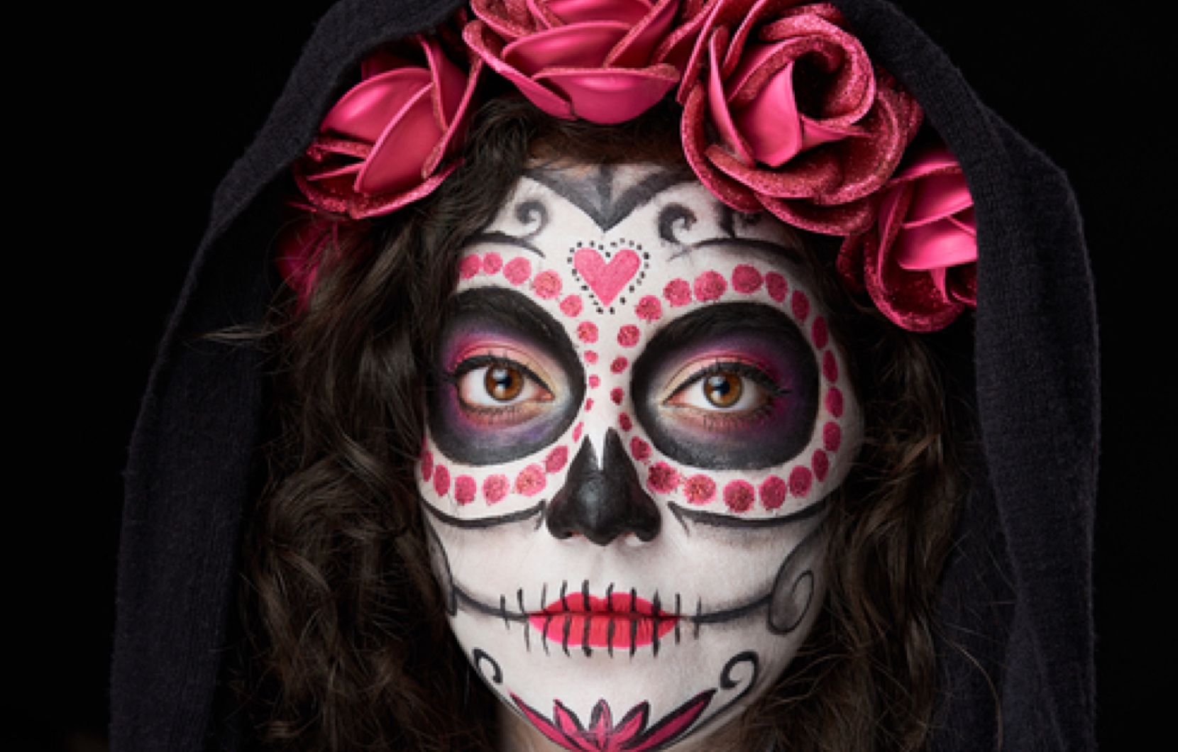 Colorful, vibrant, and haunting—Calavera makeup is an integral part of the holiday.