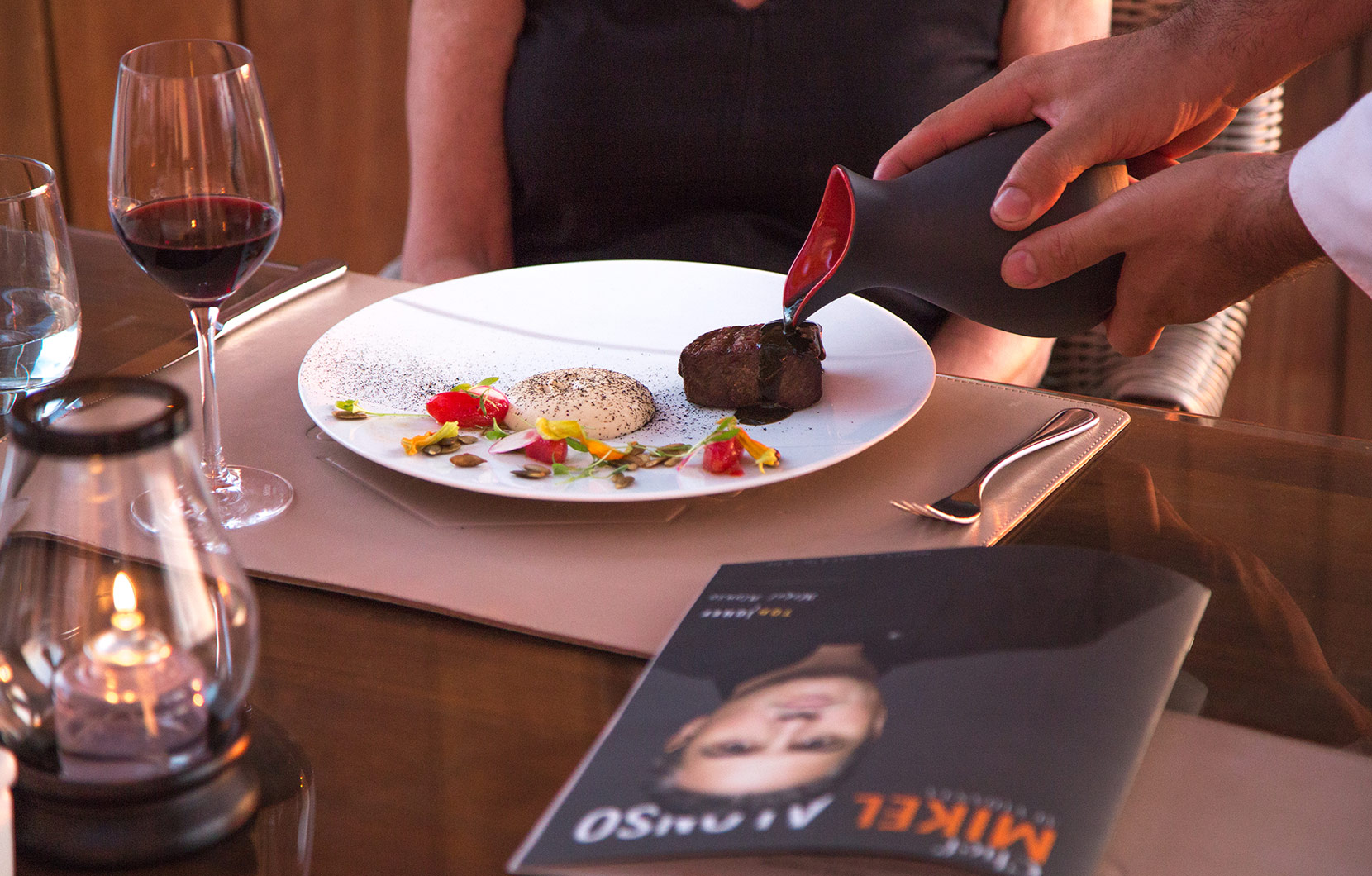 A diner enjoys the 8-course menu prepared by Chef Alonso at Quinto.