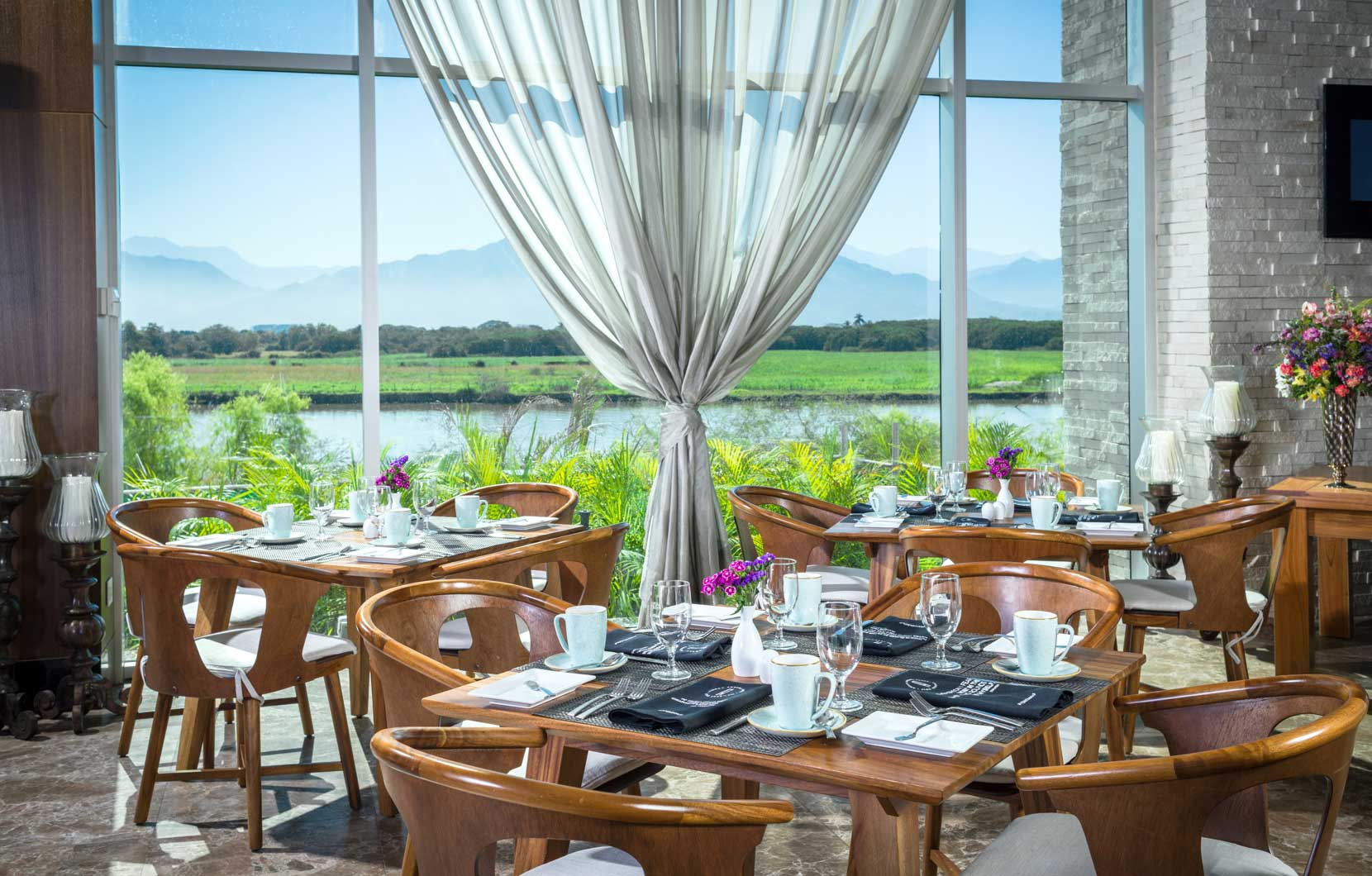 The chic and sophisticated dining room showcases the amazing views.