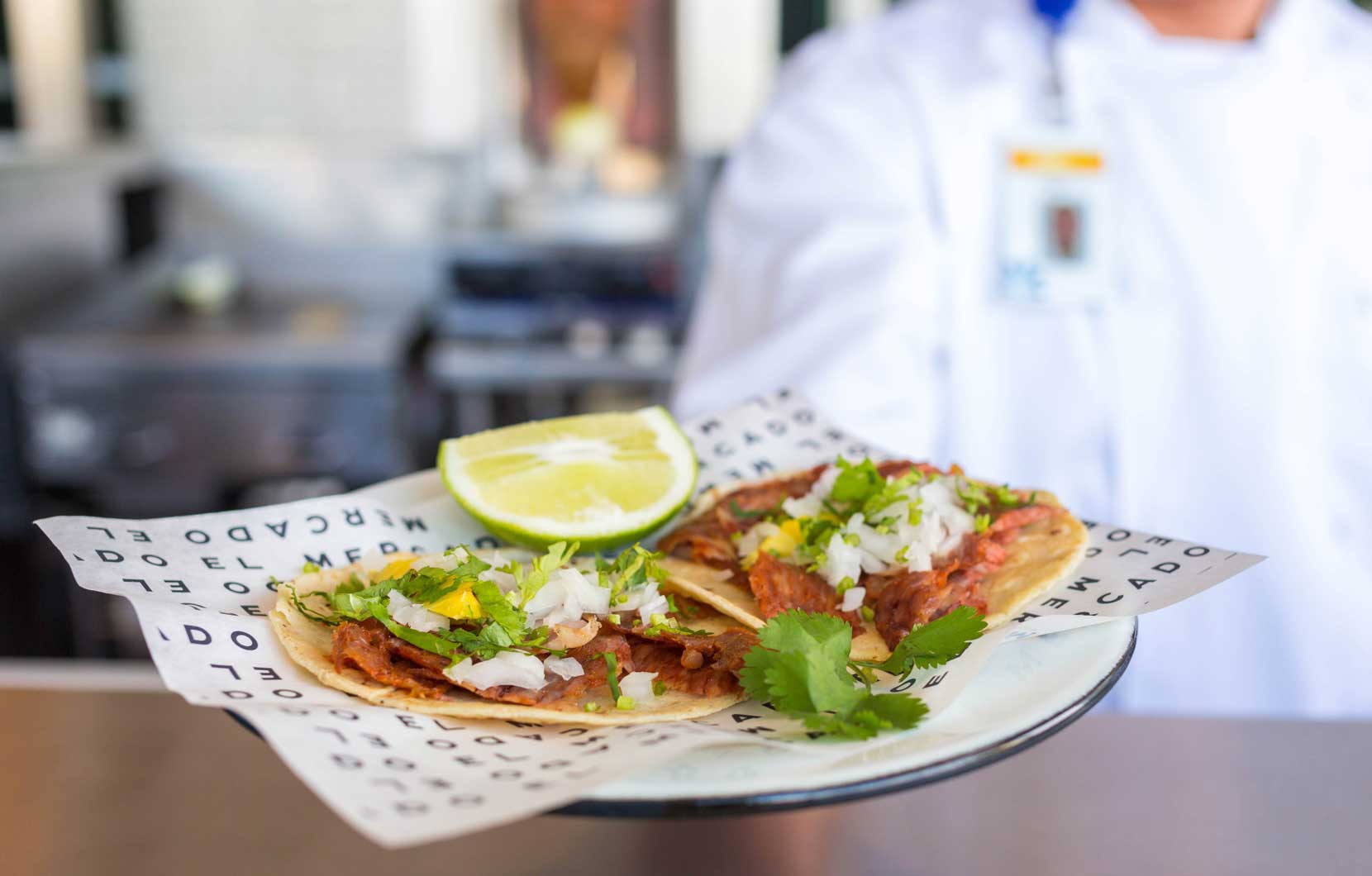 Chef Neri presenting his amazing tacos al pastor at Mercado México.