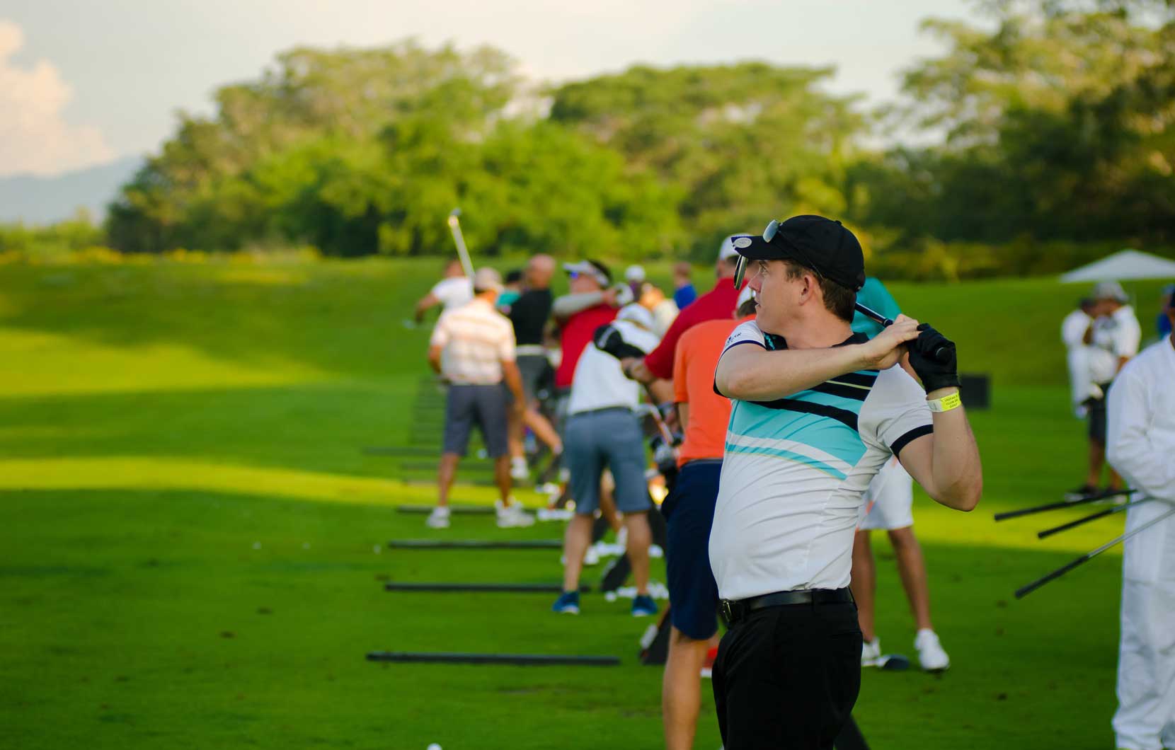 A few competitors warm up on the course.