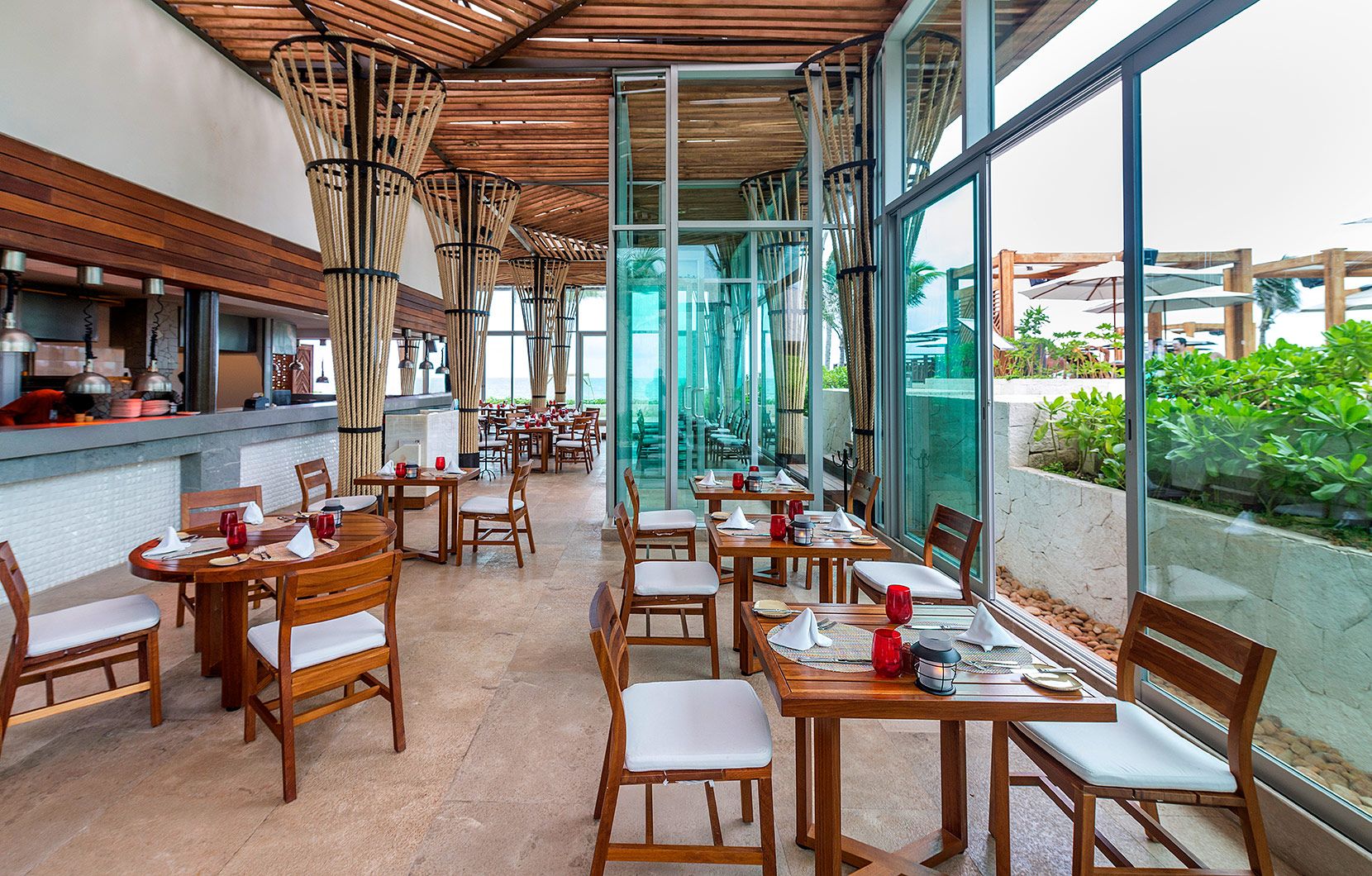 Dramatic floor-to-ceiling windows bring the outside into Chiringuito.