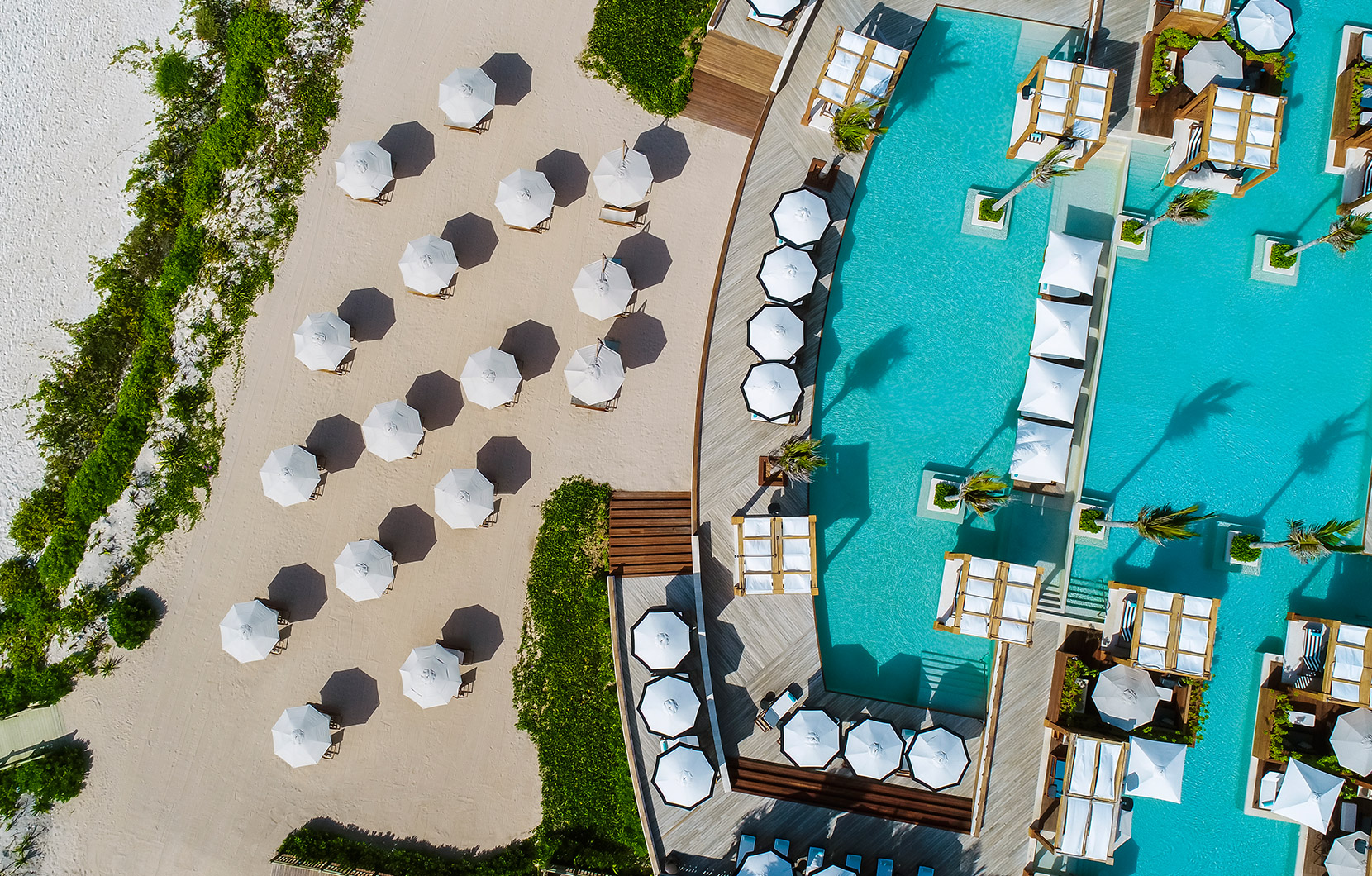 An aerial shot of The Beach Club displays its striking design from above.